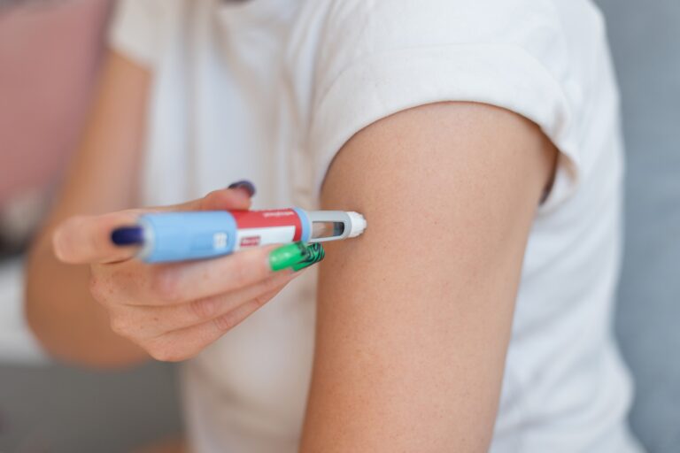 fat girl injects the drug Ozempic into her arm for weight loss at home.